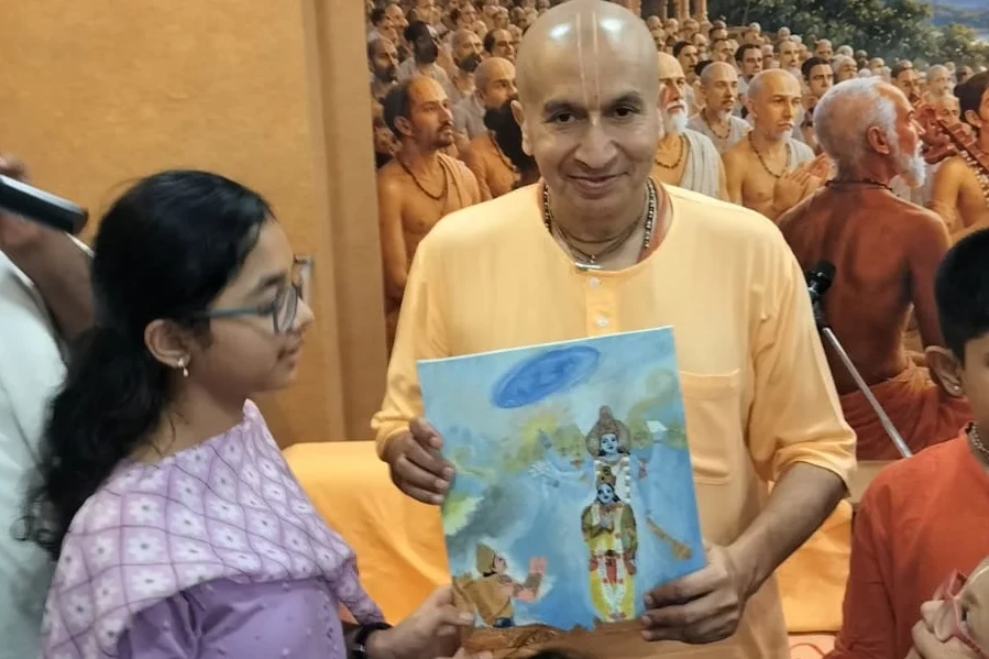 Zenith devotee offering a drawing to H.G. Gauranga Das Prabhu