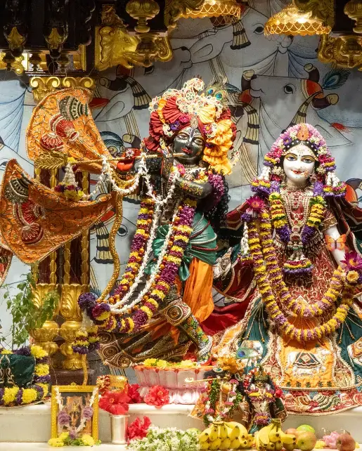 Radha Krishna deities with golden chariot in Krishna Consciousness temple